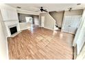 Spacious living room with hardwood floors, fireplace, and staircase at 2711 Thornbush Ct, Charlotte, NC 28270