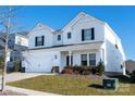 Two-story white house with black shutters, two-car garage, and landscaping at 3962 Isenhour Rd, Kannapolis, NC 28081