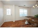 Farmhouse style dining set with wood table and benches in a bright dining room at 4182 Cordell Ct, Midland, NC 28107