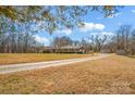 Ranch style brick house on a gravel driveway at 421 Wood Bridge Rd, Statesville, NC 28625