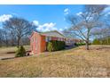 Brick ranch house with side yard and landscaping at 421 Wood Bridge Rd, Statesville, NC 28625