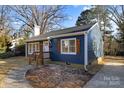 Updated blue house with white accents, shutters, and walkway at 529 Ambassador St, Charlotte, NC 28208