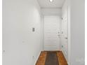 Entry hallway with tile and front door, plus a door to another room at 5818 Harris Grove Ln, Charlotte, NC 28212