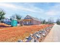 Charming exterior of a new construction home with a covered porch on a spacious lot at 604 E Ridge St, Kings Mountain, NC 28086