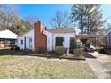 Front view of a white house with carport and landscaping at 617 York S Ave, Rock Hill, SC 29730