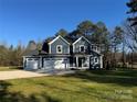 Beautiful two-story home with a three car garage and a well manicured lawn at 8768 Sherrills Ford Rd, Sherrills Ford, NC 28673