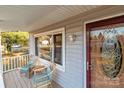 Relaxing front porch features wicker chairs and a small table at 120 Moyle Ave, Salisbury, NC 28146