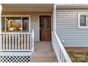 Inviting front porch with white railings and wooden floor at 120 Moyle Ave, Salisbury, NC 28146