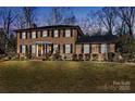 Two-story brick home with a charming curb appeal at dusk at 140 Kent Rd, Salisbury, NC 28147