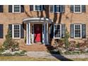 Welcoming front entrance with a red door and a classic portico at 140 Kent Rd, Salisbury, NC 28147