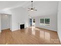 Bright living room featuring hardwood floors and a fireplace at 1409 Bicycle Ct, York, SC 29745