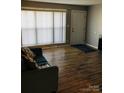 Living room featuring hardwood floors and a comfy sofa at 1825 Herrin Ave, Charlotte, NC 28205