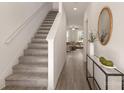 Bright entryway with stairs, hardwood floors, and a view to the living room at 2029 Tom Sadler Rd, Charlotte, NC 28214