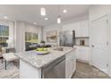 Spacious kitchen with an island, stainless steel appliances, and granite countertops at 2029 Tom Sadler Rd, Charlotte, NC 28214