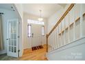 Bright entryway with hardwood floors, a staircase, and French doors at 2131 Ashley Glen Way, Fort Mill, SC 29707