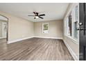 Bright living room with neutral walls, hardwood floors, and ceiling fan at 2829 1St Nw Ave, Hickory, NC 28601