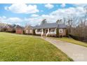 Beautiful brick home boasting a well-manicured lawn and a classic front porch, perfect for relaxation and curb appeal at 2865 Scarborough Ct, Gastonia, NC 28054