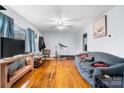 Comfortable living room featuring hardwood floors and ample natural light from a large window at 2907 1St Nw Ave, Hickory, NC 28601