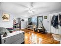 Bright living room with wood floors, a ceiling fan, and a view of the kitchen at 2907 1St Nw Ave, Hickory, NC 28601