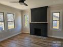 Spacious living room with a brick fireplace and hardwood floors at 330 West Blvd, Charlotte, NC 28203