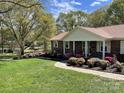 Ranch home with manicured lawn and azaleas at 3333 Audrey Dr, Gastonia, NC 28054