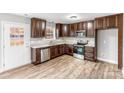 L-shaped kitchen with granite countertops and ample cabinet space at 413 Peach St, Kannapolis, NC 28083