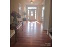 Bright foyer with hardwood floors, decorative columns, and ample natural light at 5421 Roberta Meadows Ct, Concord, NC 28027