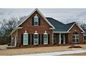 Charming brick home with black shutters and well-maintained front yard at 5421 Roberta Meadows Ct, Concord, NC 28027