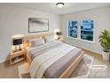 Bright bedroom with a large bed and window at 744 Bartram Ave, Concord, NC 28025