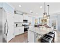 Spacious kitchen with white cabinets, granite countertops, and an island at 8023 Alford Rd, Fort Mill, SC 29707