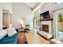 Spacious living room with vaulted ceiling, fireplace, and hardwood floors at 8049 Charter Oak Ln, Charlotte, NC 28226