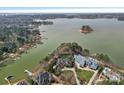 Luxury lakefront properties showcase the serene peninsula setting and expansive water views at 155 Union Chapel Dr, Mooresville, NC 28117