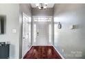 Bright entryway with hardwood floors and door to living room at 2016 Legend Creek Ln, Mint Hill, NC 28227