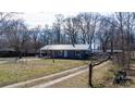 Attractive one-story house with a metal roof and a large front yard at 3021 Tryon Courthouse Rd, Bessemer City, NC 28016