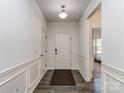 Bright and airy entryway with wood-look floors and neutral colors at 5220 Admirals Lndg, Lancaster, SC 29720