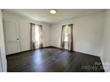 Spacious bedroom with dark hardwood floors and ample natural light at 556 6Th St, Chester, SC 29706