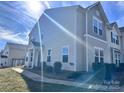 Tan two-story house with gray accents, walkway, and landscaping at 801 Ranchero St, Statesville, NC 28677