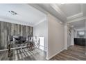 Bright office with a wood accent wall, modern desk, and wood-look floors at 1169 Hollis Sw Cir, Concord, NC 28025