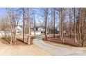 House with a long driveway, surrounded by trees at 174 Country Lake Dr, Mooresville, NC 28115