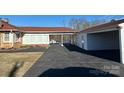 Brick ranch home with attached garage and covered patio at 1915 Pleasant Hill Church Rd, Shelby, NC 28152