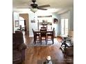 Open dining room with hardwood floors and kitchen view at 2521 Whistler Ct, Newton, NC 28658