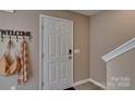 Front entry with coat hooks and a view of the staircase at 3048 Ora Smith Rd, Lincolnton, NC 28092