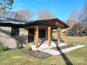 Covered porch with wood columns and ceiling fan at 4165 Laurelwood Ct, Concord, NC 28025