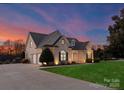 Brick home with 3-car garage, at dusk at 498 New Salem Rd, Statesville, NC 28625