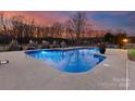 Relaxing in-ground pool at dusk at 498 New Salem Rd, Statesville, NC 28625