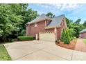 Two-car attached garage with a brick exterior at 508 Cobbs Glen Ct, Rock Hill, SC 29732