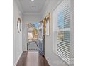 Bright entryway with hardwood floors, transom window, and view of the front door at 571 Palmarosa St # 130, Fort Mill, SC 29715