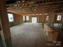 Unfinished interior showcasing the framing, abundant natural light, and a layout ready for customization at 1012 Farm Branch Ct, Indian Trail, NC 28079