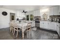 Bright kitchen with an eat-in dining area and white cabinetry at 1241 Red River Rd, Rock Hill, SC 29730