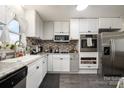 Modern kitchen with white cabinets, stainless steel appliances, and granite counters at 1241 Red River Rd, Rock Hill, SC 29730